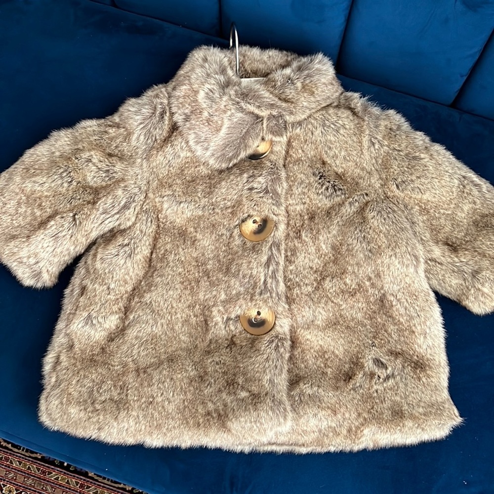 Brown faux fur children’s coat.